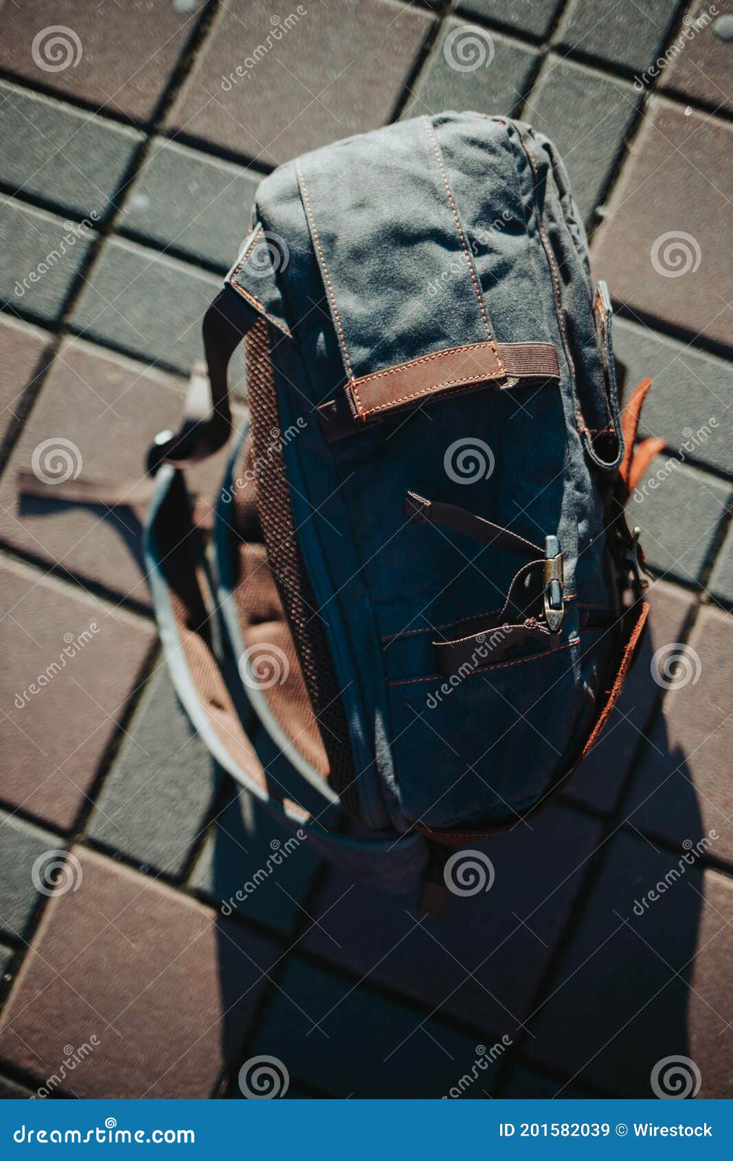 Vertical Shot of a Leather Backpack on the Sidewalk Stock Image Image