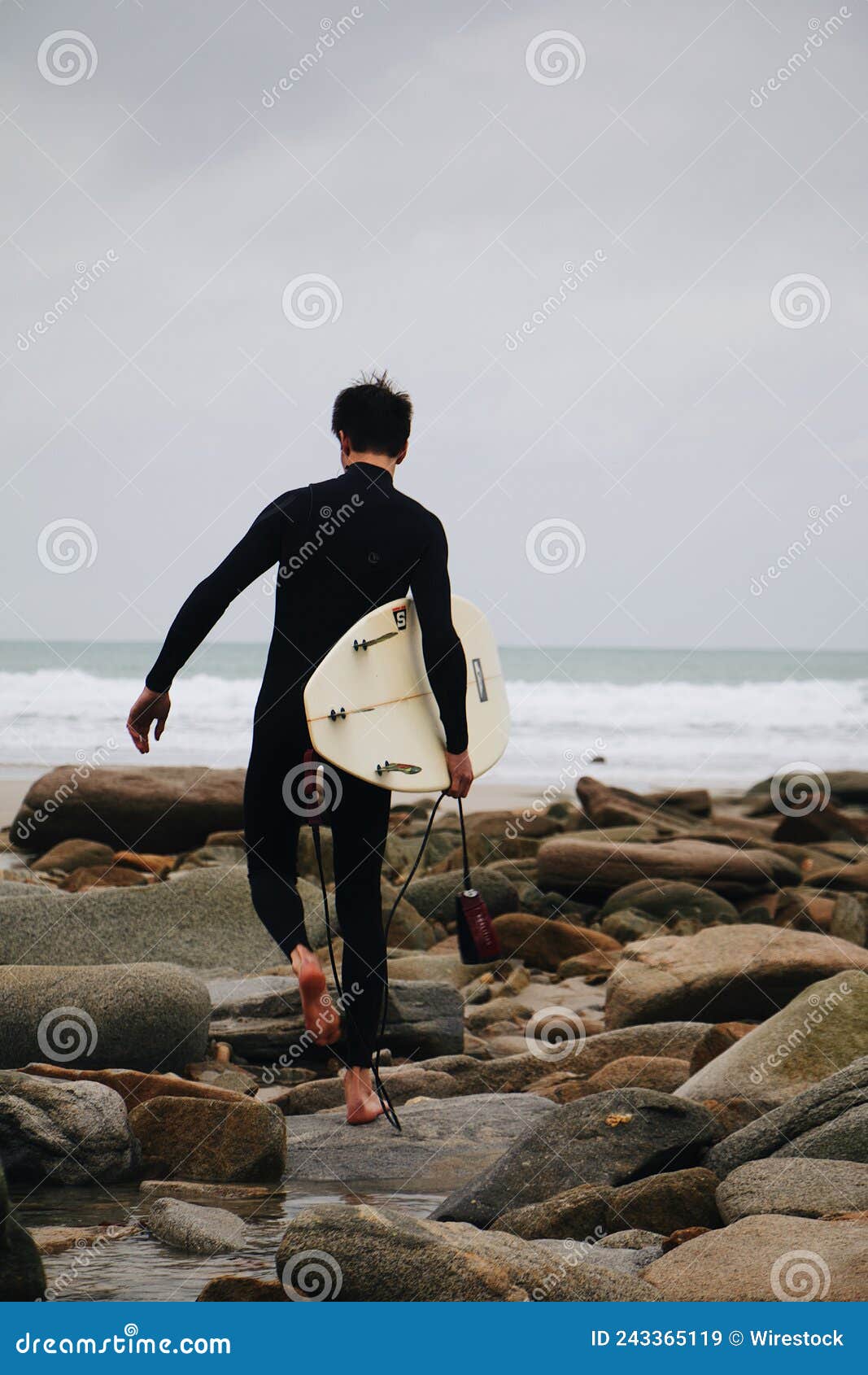 vertical shot of a man doing surfing processed with vsco