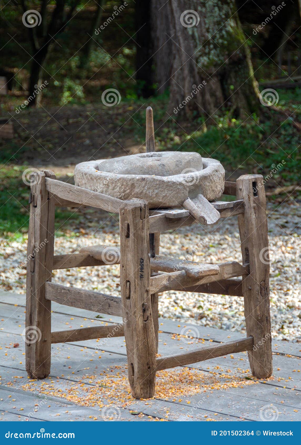 Vertical Shot of an Old Manual Stone Mill for Crushing Grain on the