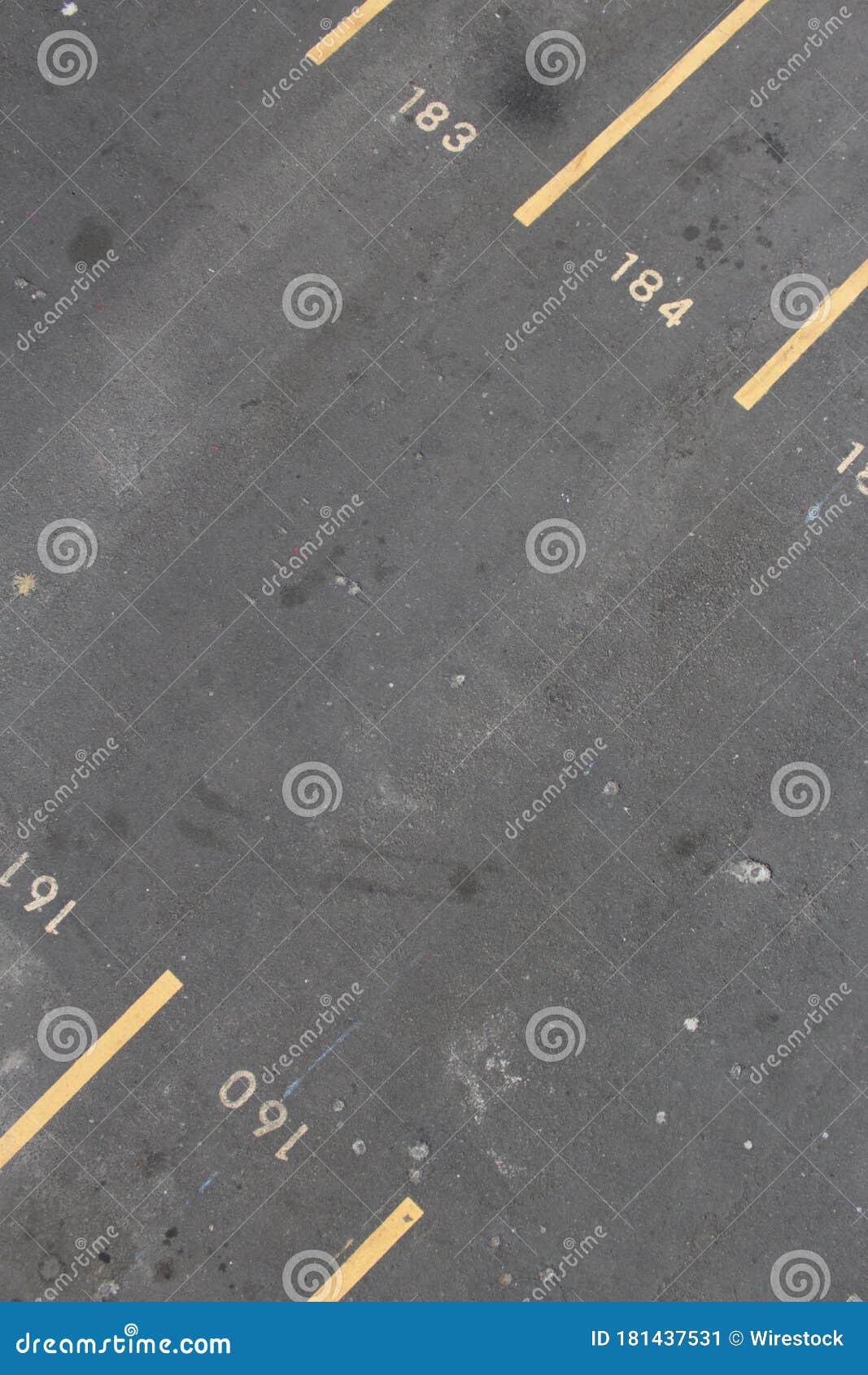 Vertical Shot of a Parking Lot with Numbers and Yellow Lines Stock
