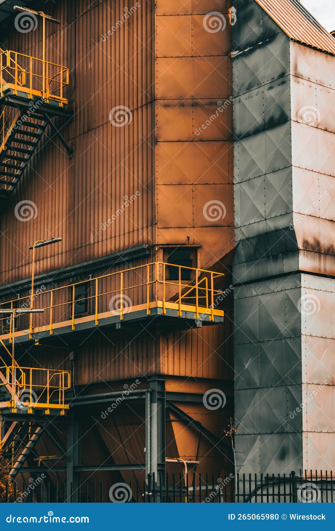 Vertical Shot of the Part of a Structure with Rusty Orange and Gray