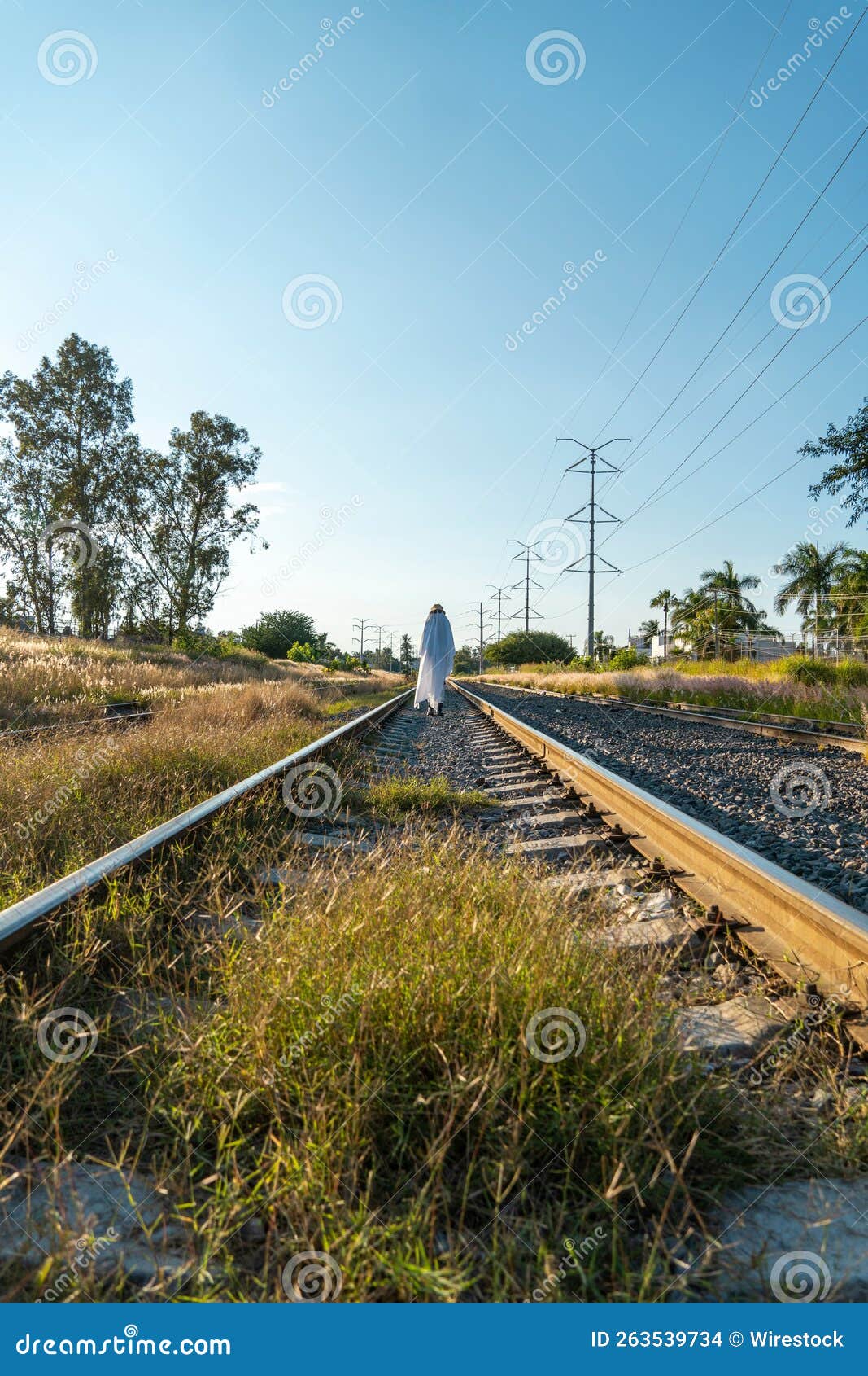 Man Crouching on Train Rails · Free Stock Photo