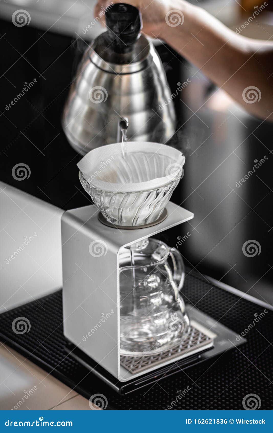 Vertical Shot of a Person Making Filtered Brewed Coffee Stock Photo