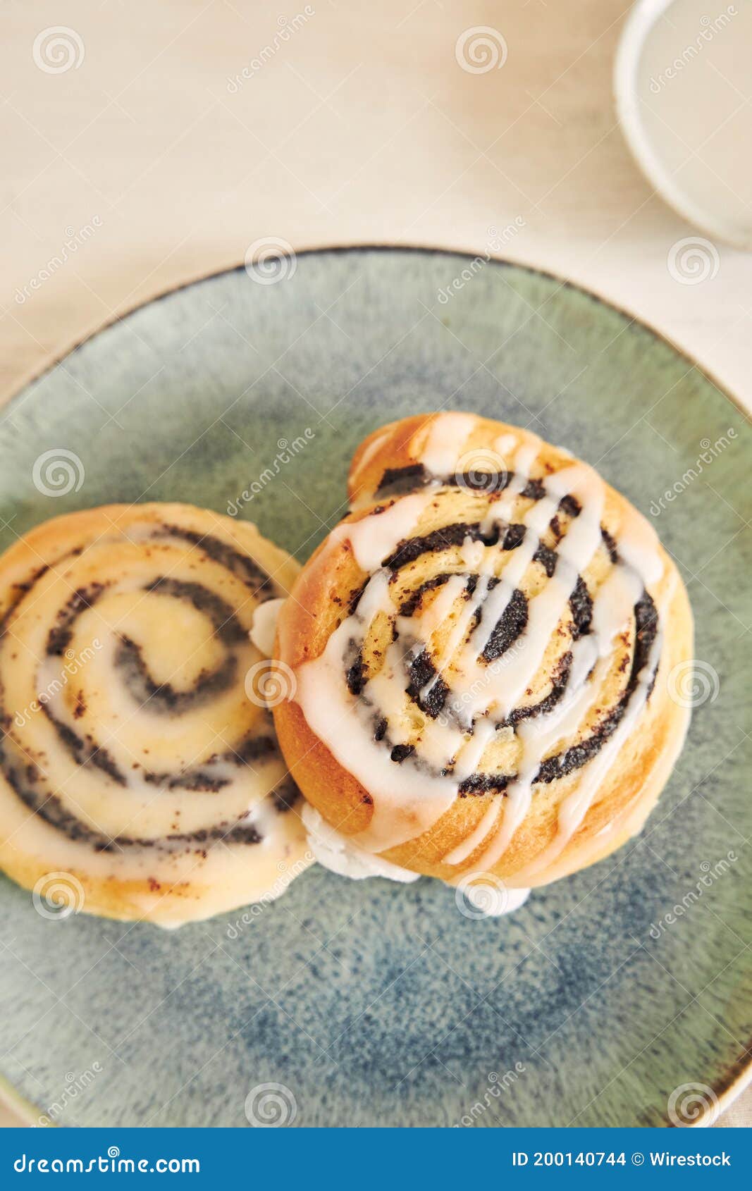 Vertical Shot of Poppy Seed Rolls with Sugar Glaze Stock Photo Image