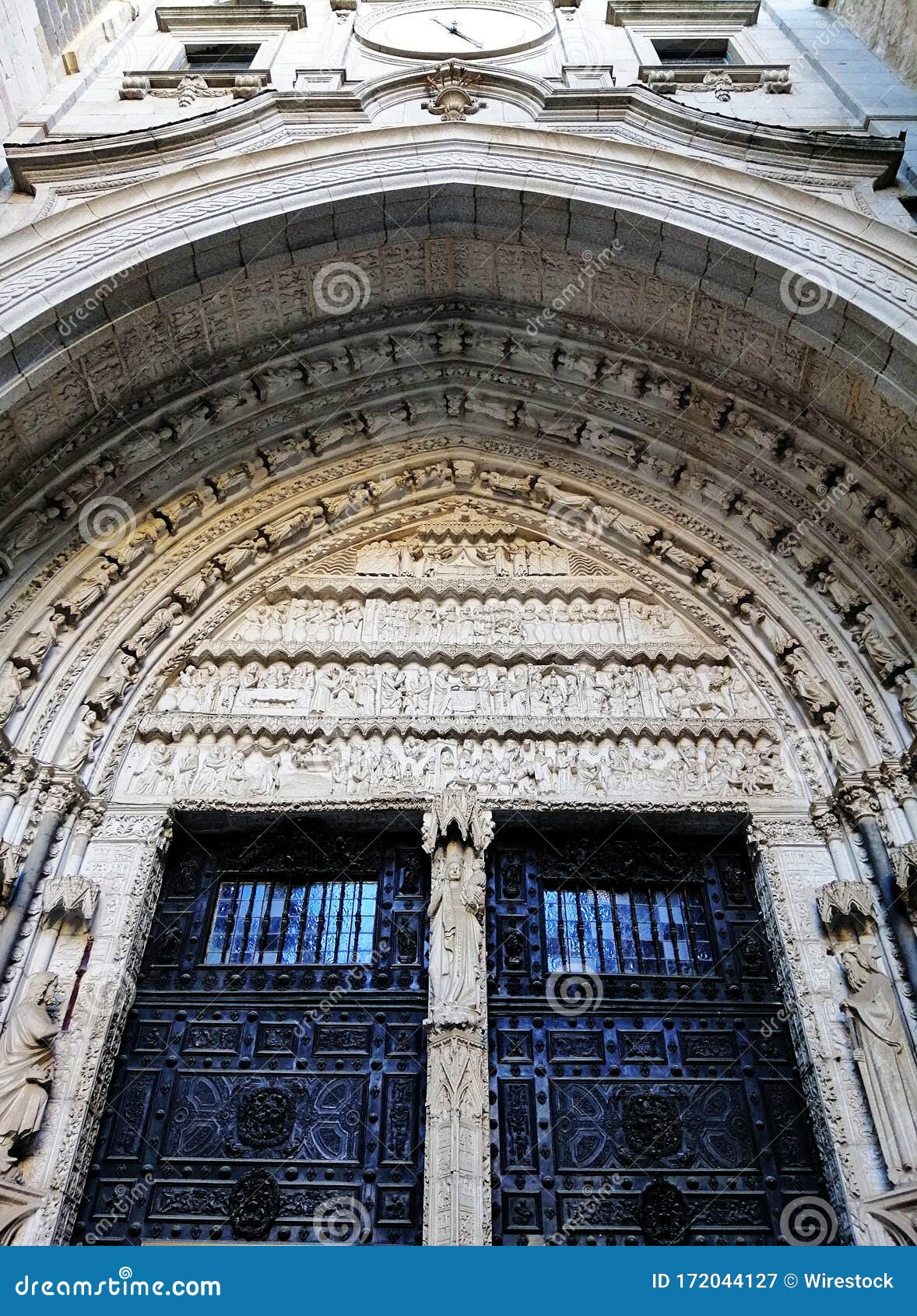vertical shot of santa iglesia catedral primada de toledo entrance in toledo, spain