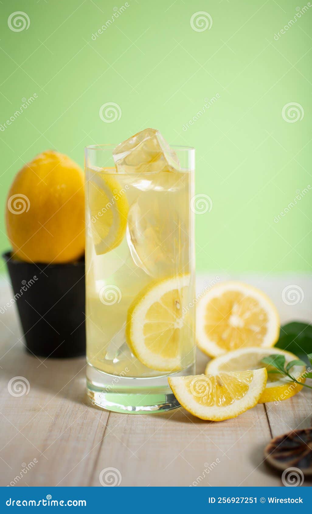 Vertical Shot of Sliced Lemons with a Glass of Lemon Jouce Stock Image ...