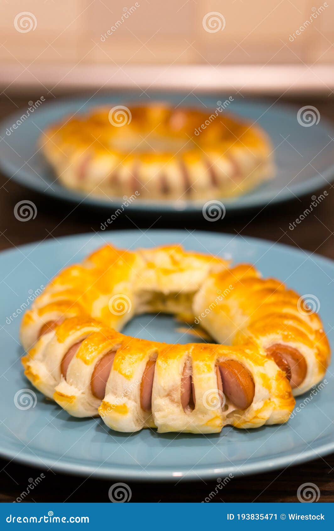 Vertical Shot of Spiral Bread Wrapped Sausage on a Plate Stock Image Image of vertical, smoked