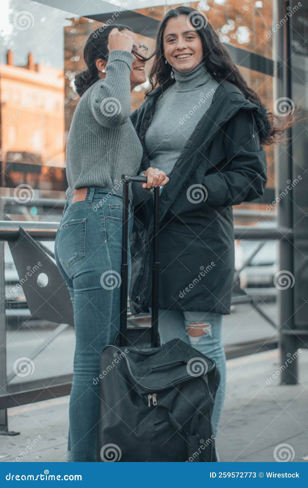 Vertical Shot Of Two Spanish Girls Holding A Luggage Stock Image Image Of Girls Outdoors