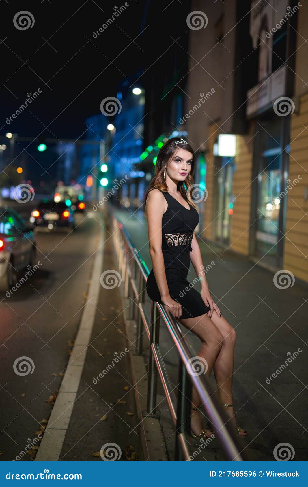 Vertical Shot of a Young Female Model in an Elegant Black Dress Posing ...