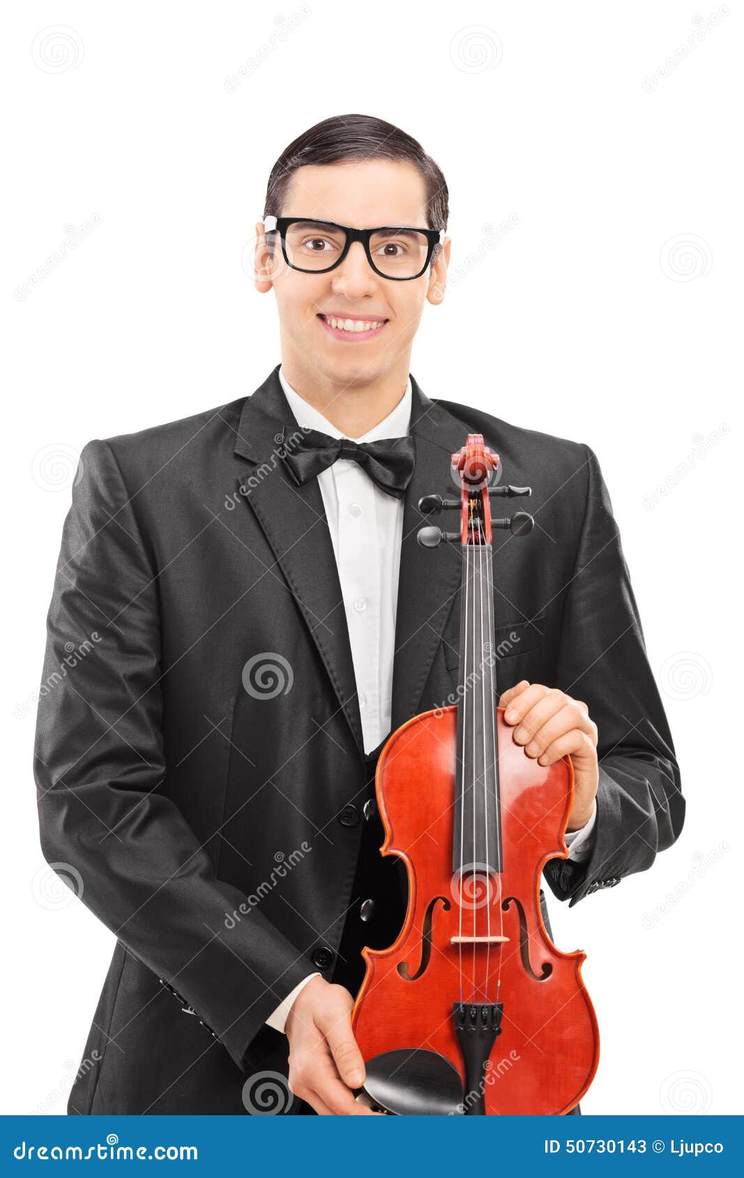 Vertical Shot of a Young Musician Posing with a Violin Stock Image