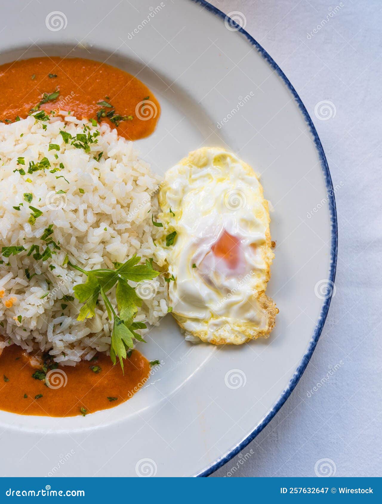 vertical top view of arroz a la cubana on the table