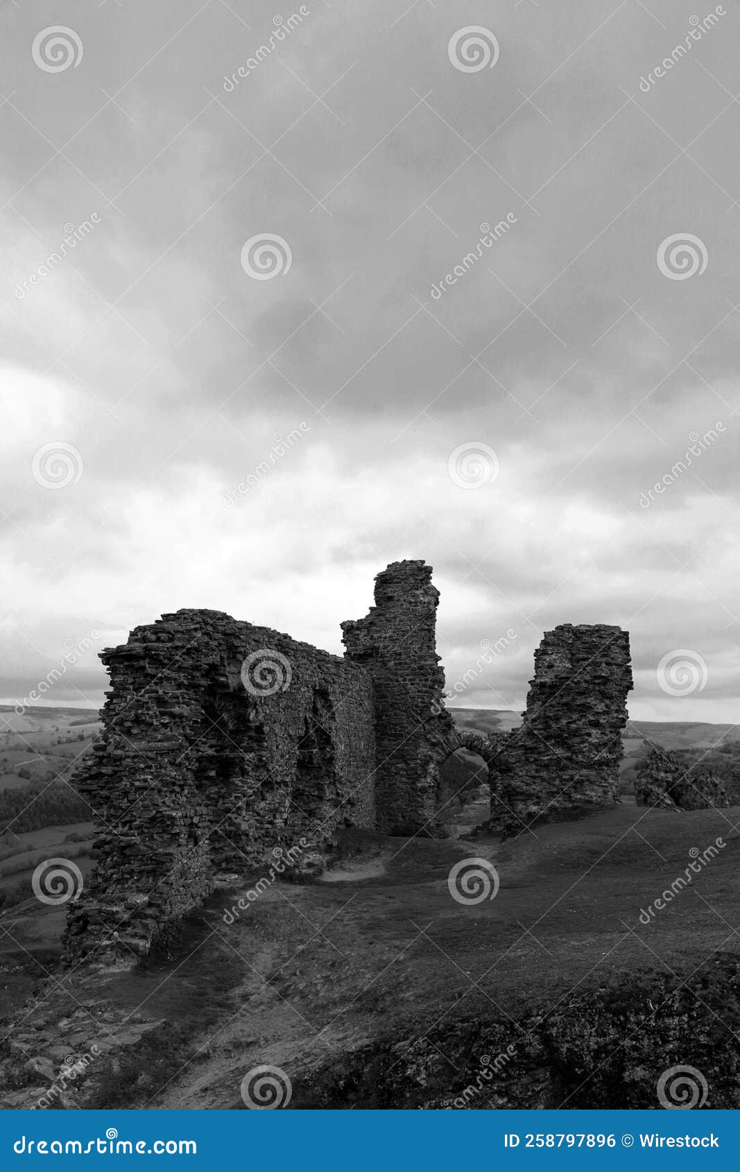 vertical view of the ancient ruins of castell dinas bran in grayscale