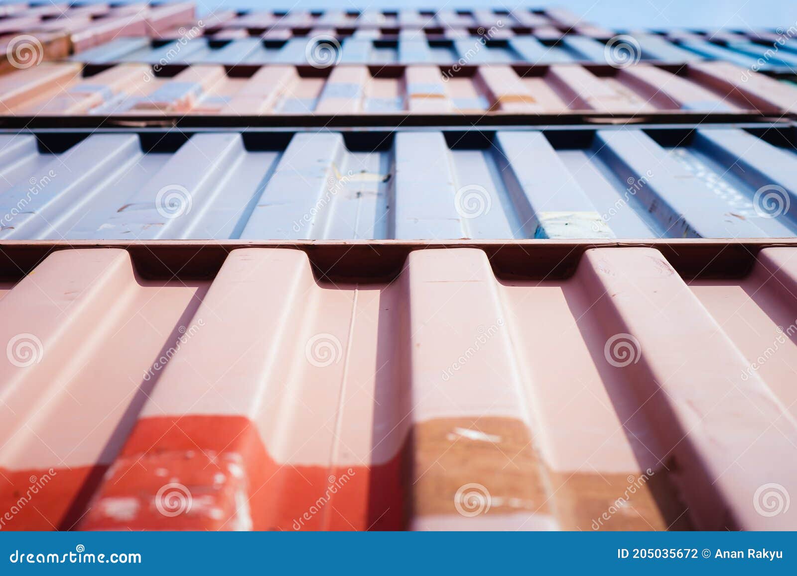 vertical view of metal surface cargo container stacked in pattern