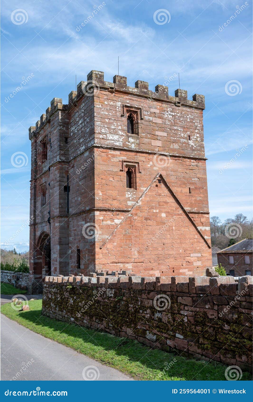 Vertical View of Wetheral Priory Gatehouse Building Under the Blue Sky
