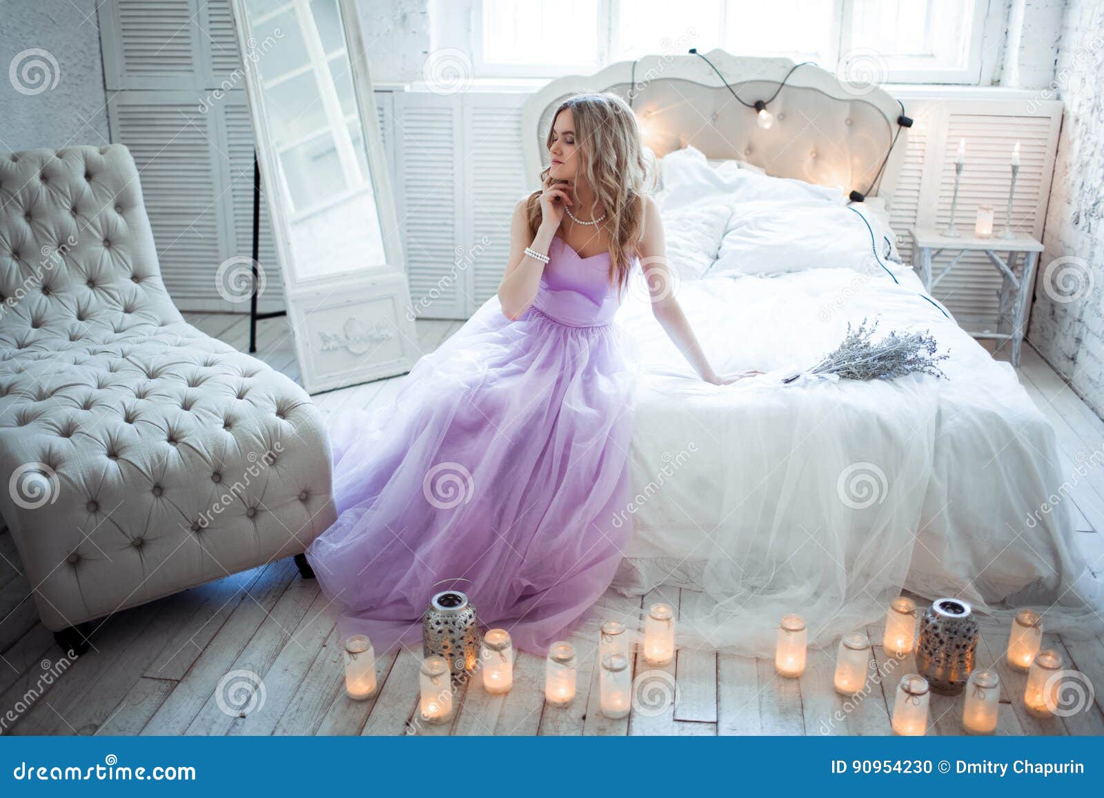 Very Beautiful Bride In A Delicate Purple Dress Sitting On