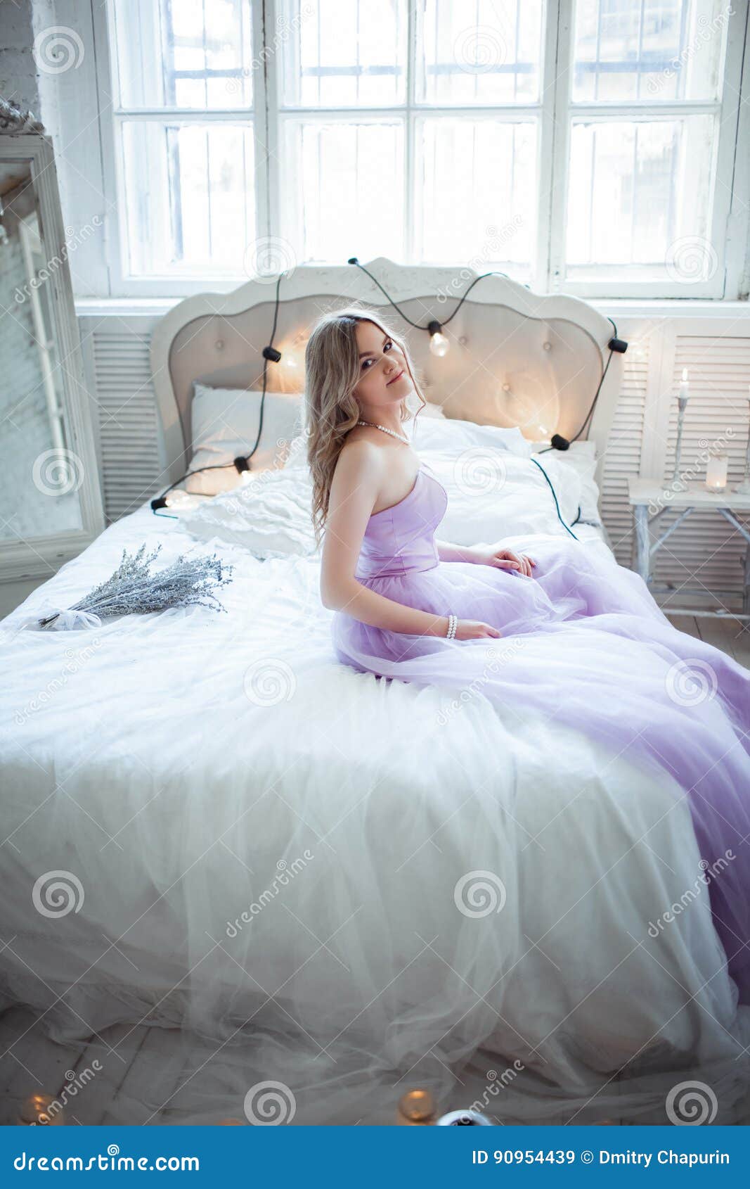 Very Beautiful Bride In A Delicate Purple Dress Sitting On