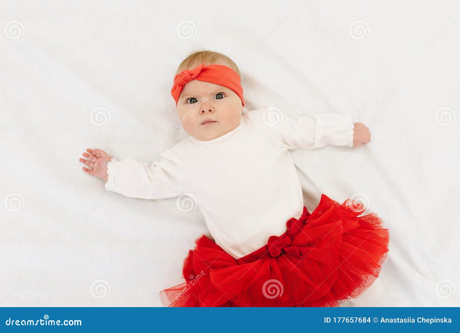 Very Cute Caucasian Baby Girl Wearing Red Skirt and Matching ...