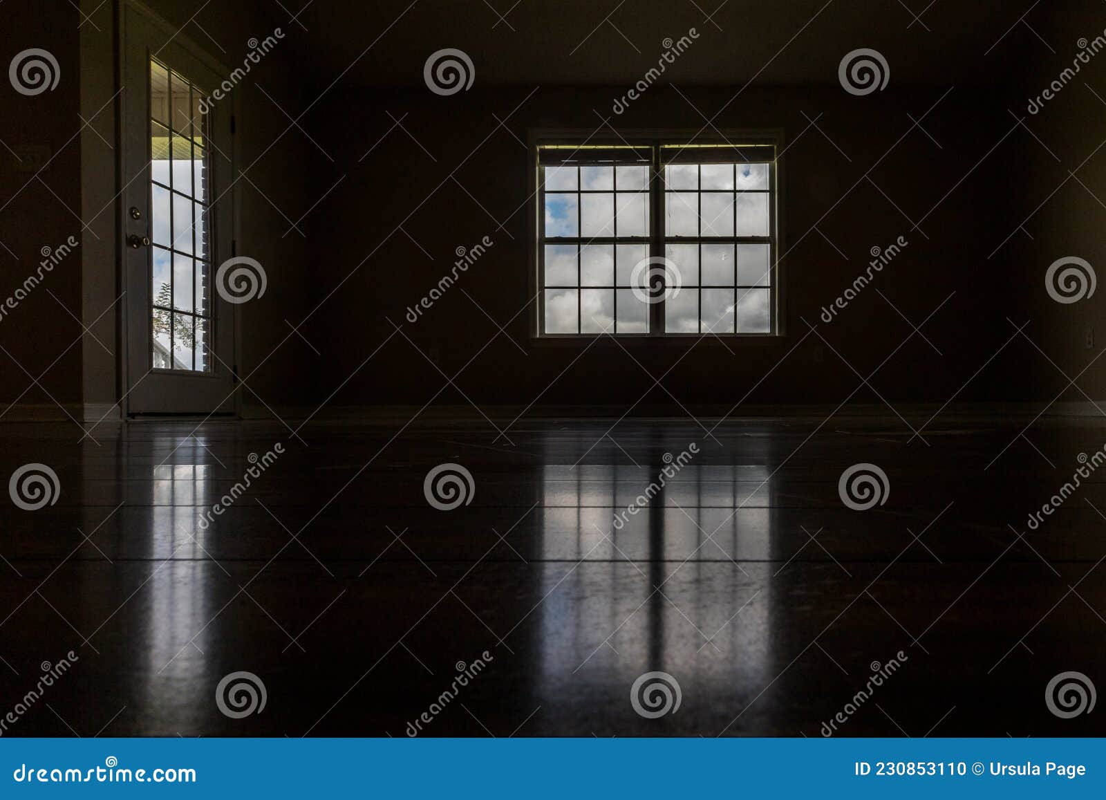 A Very Dark and almost Black Room with the only Light Coming in through