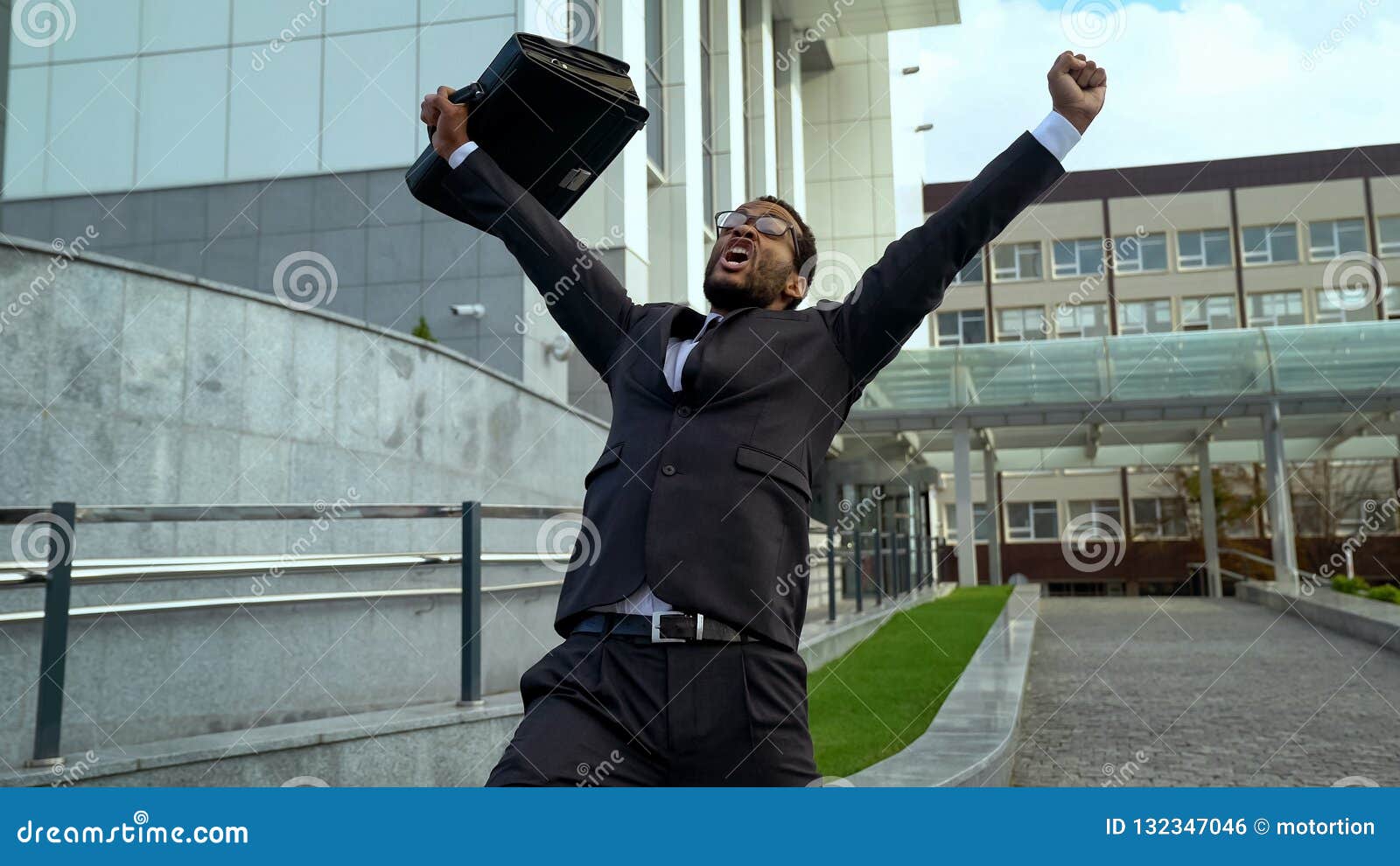 very happy mulatto office employee shouting joyfully, career promotion success