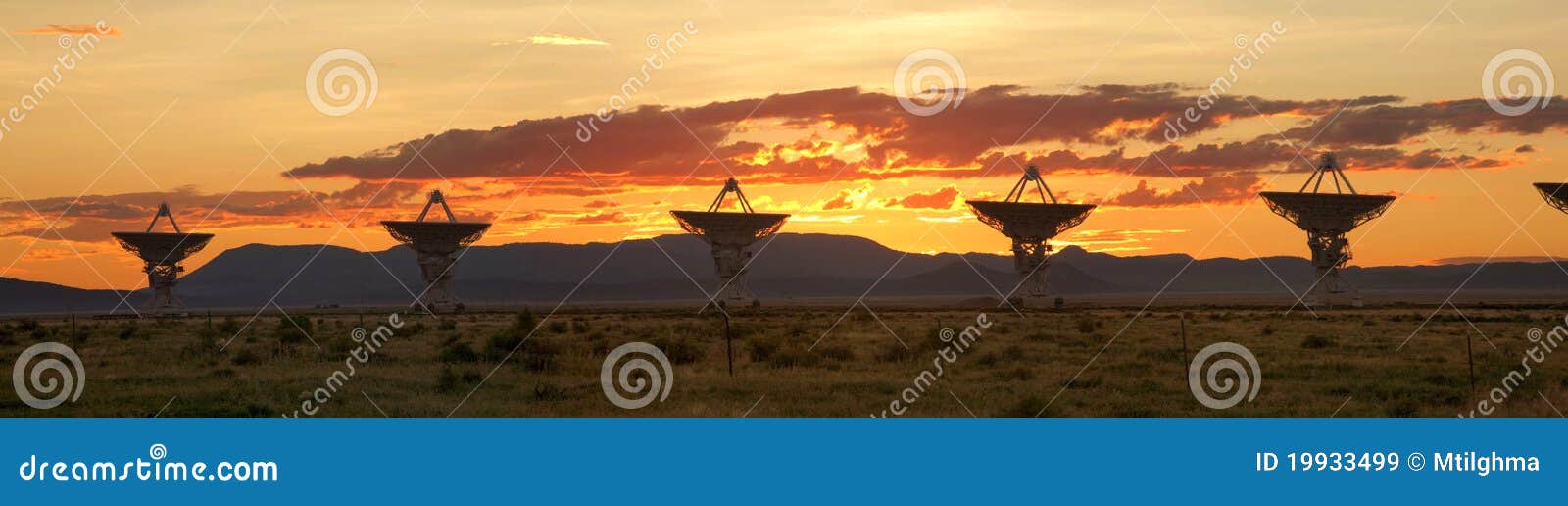 very large array at sunset (satellite dishes)