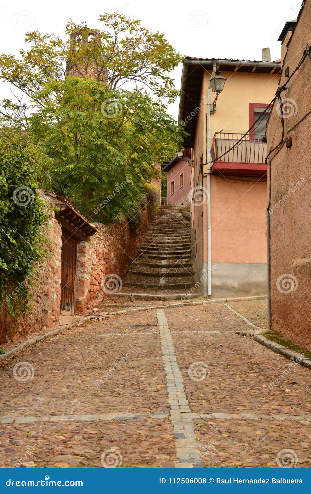 very narrow streets of a quaint village with its black slate roofs in madriguera. architecture vacation travel rural life.