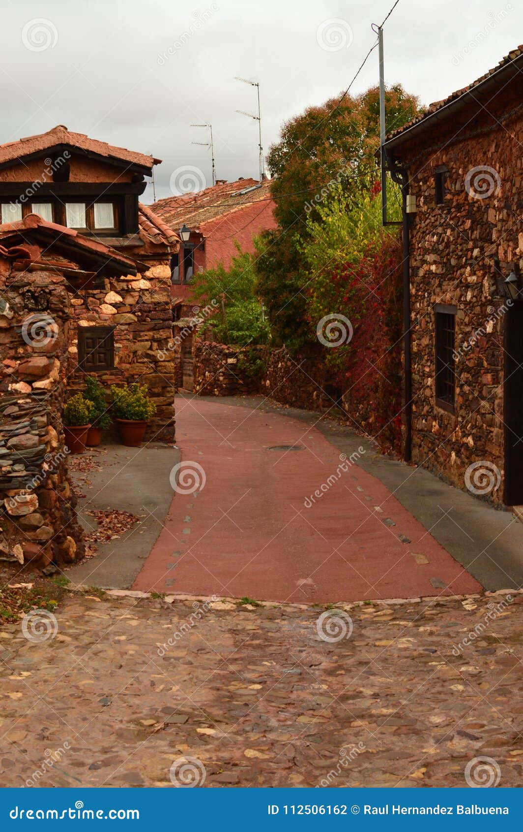 very narrow streets of a quaint village with its black slate roofs in madriguera. architecture vacation travel rural life.