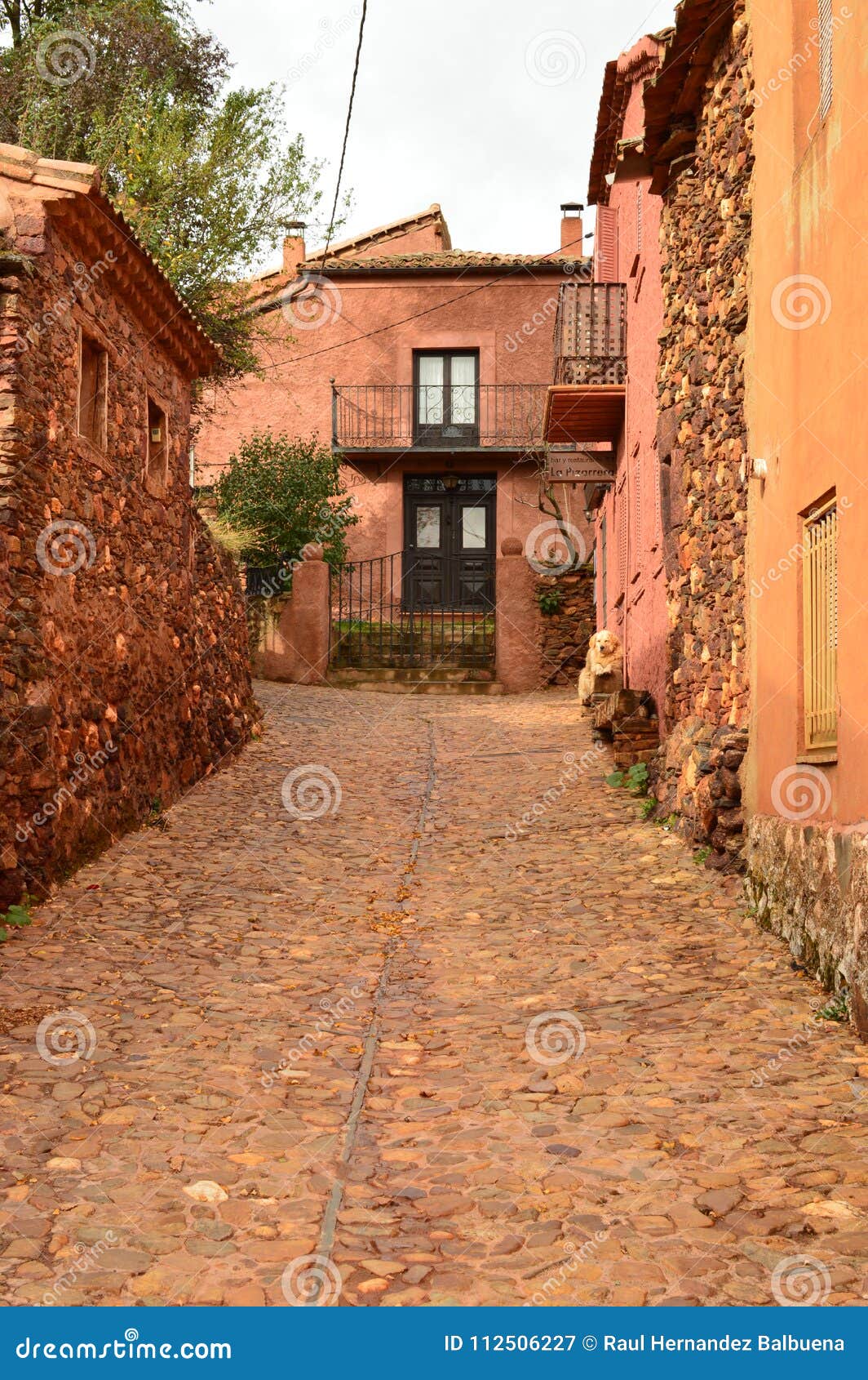 very narrow streets of a quaint village with its black slate roofs in madriguera. architecture vacation travel rural life.