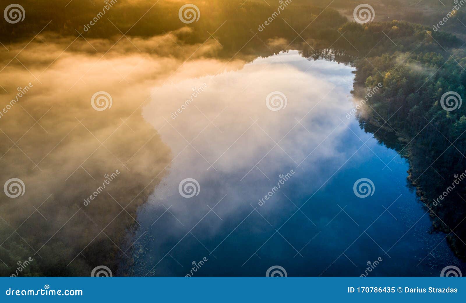 very nice aerial landscape of lake and mist during sunrise