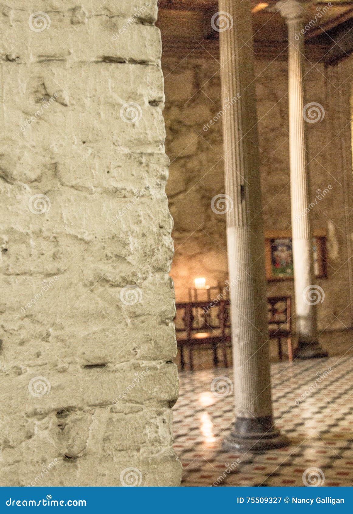 very old church with pillars and beautiful rock walls and file floors inside