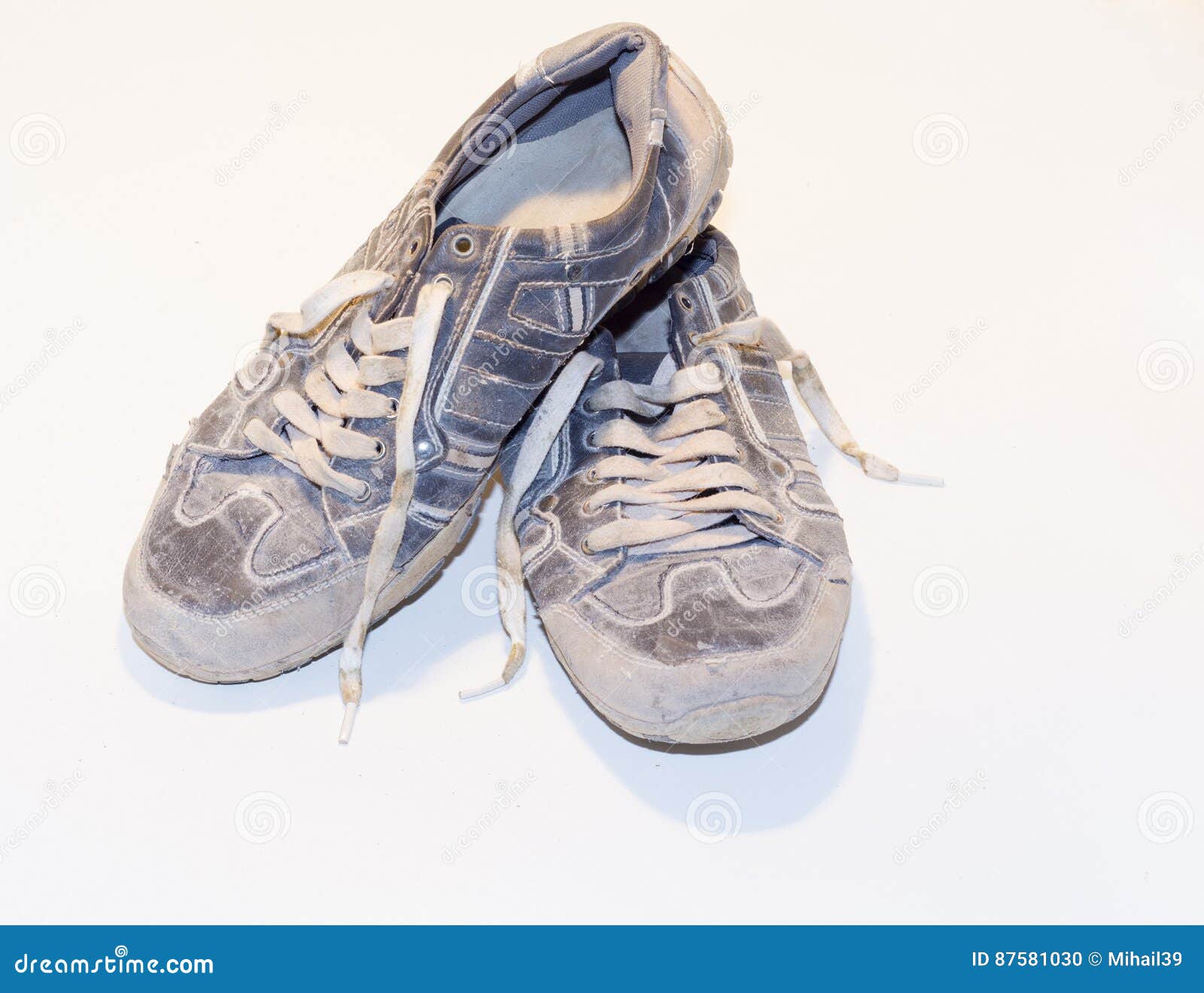 Very Old Running Shoes with Laces on a Light Background. Stock Photo ...