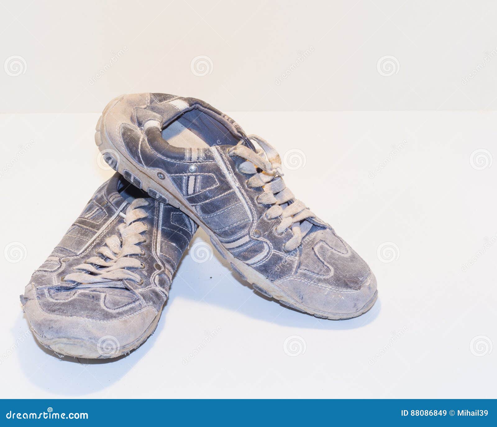 Very Old Running Shoes with Laces on a Light Background. Stock Image ...