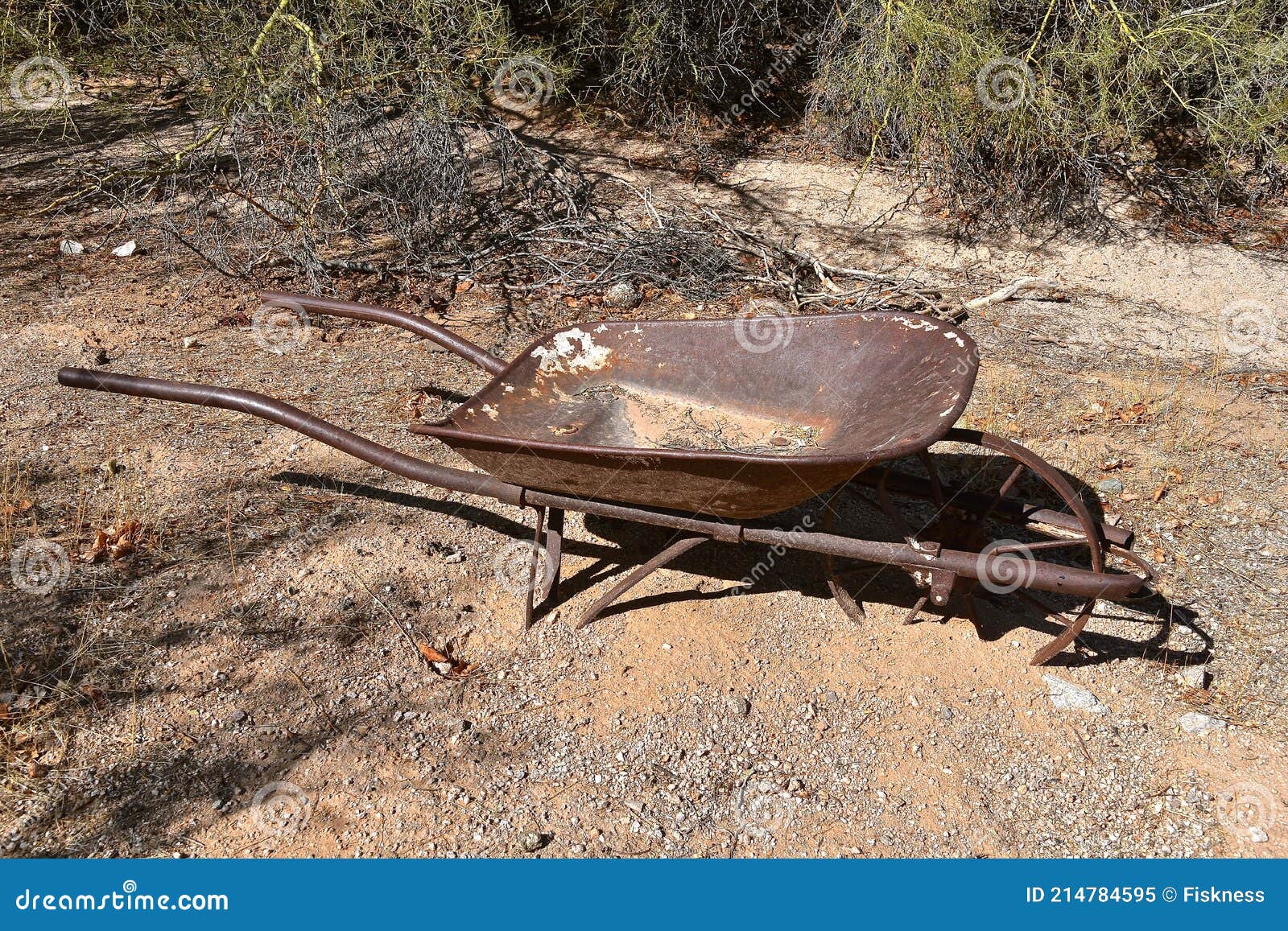 Old Rusty Wheelbarrow Left In The Rocks And Sand Stock Image Image Of