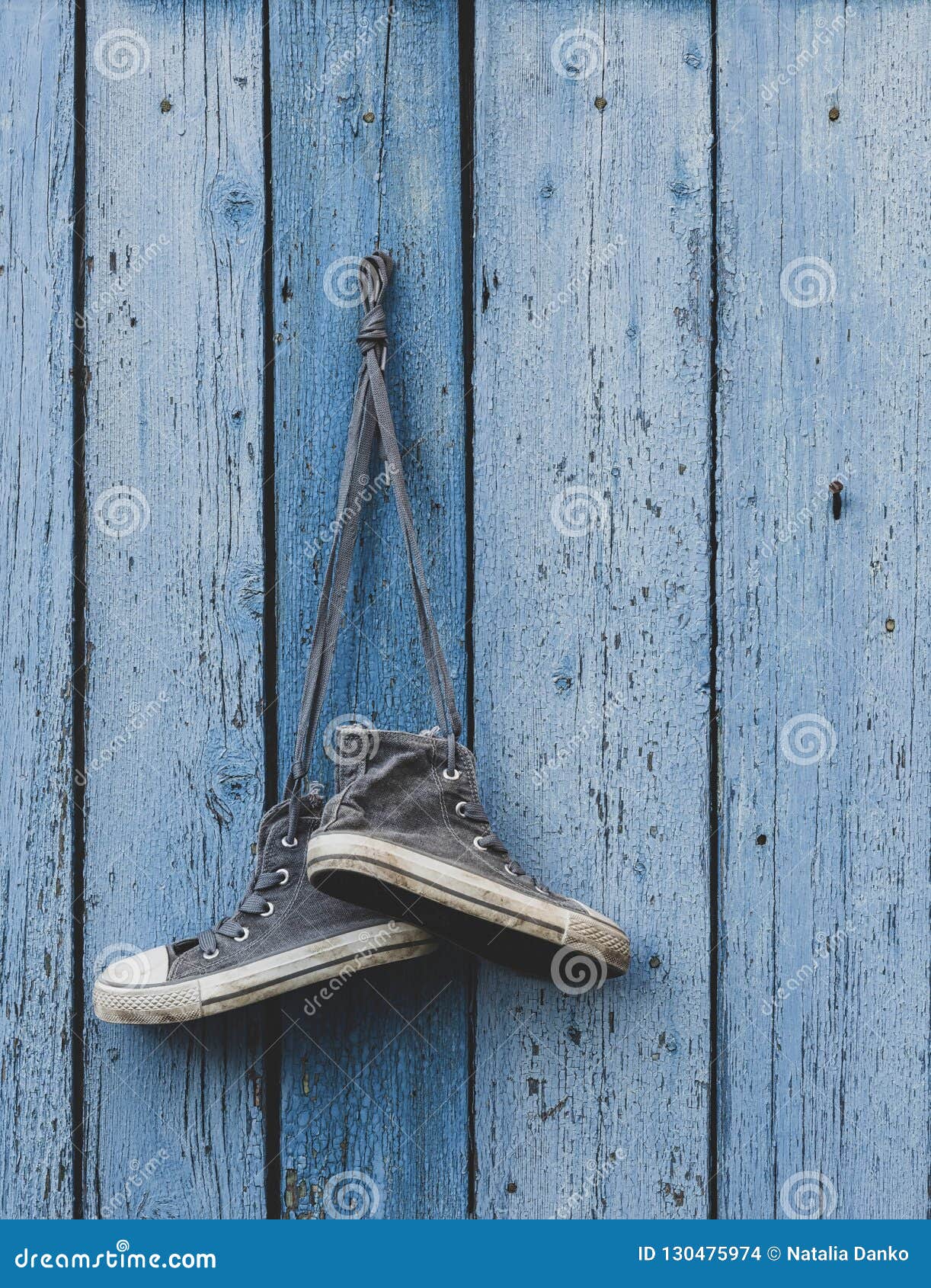 Very Old Textile Sneakers Hanging on a Nail Stock Photo - Image of ...