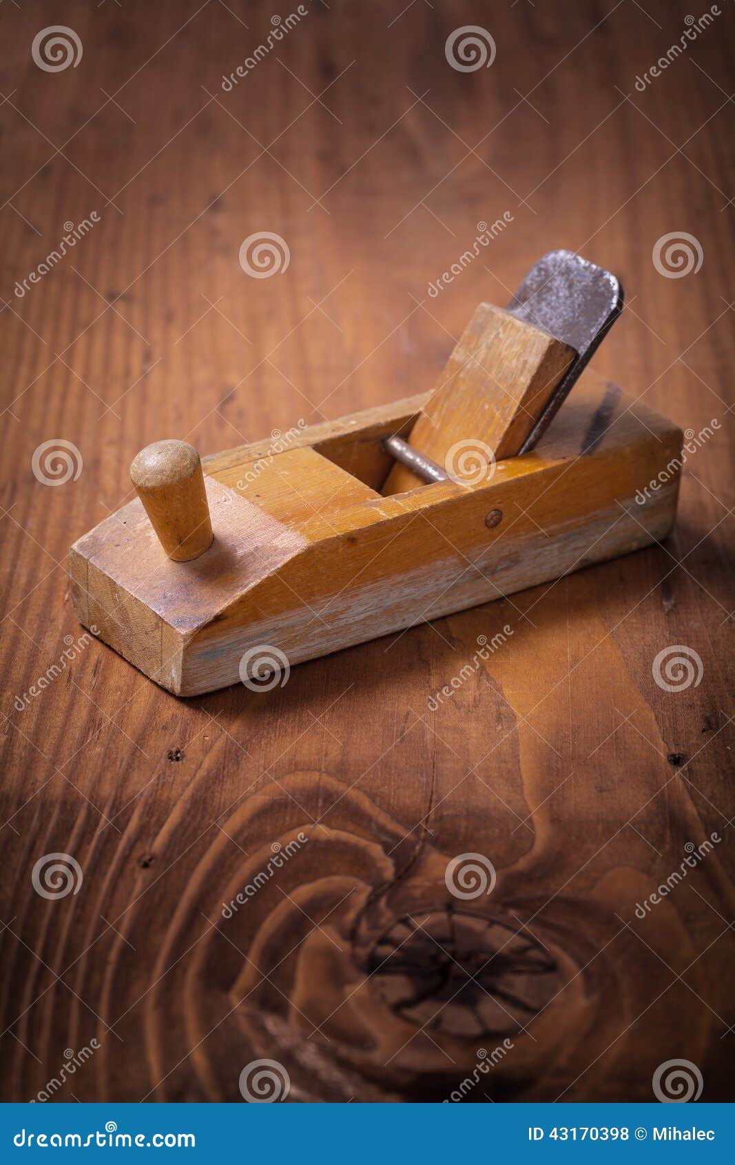 very small vintage woodworkers plane on wooden board