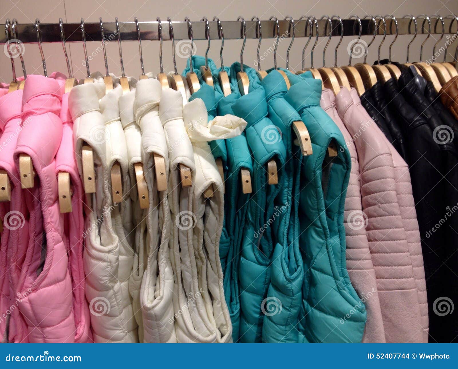 Vests hanging on hanger stock photo. Image of clothing - 52407744