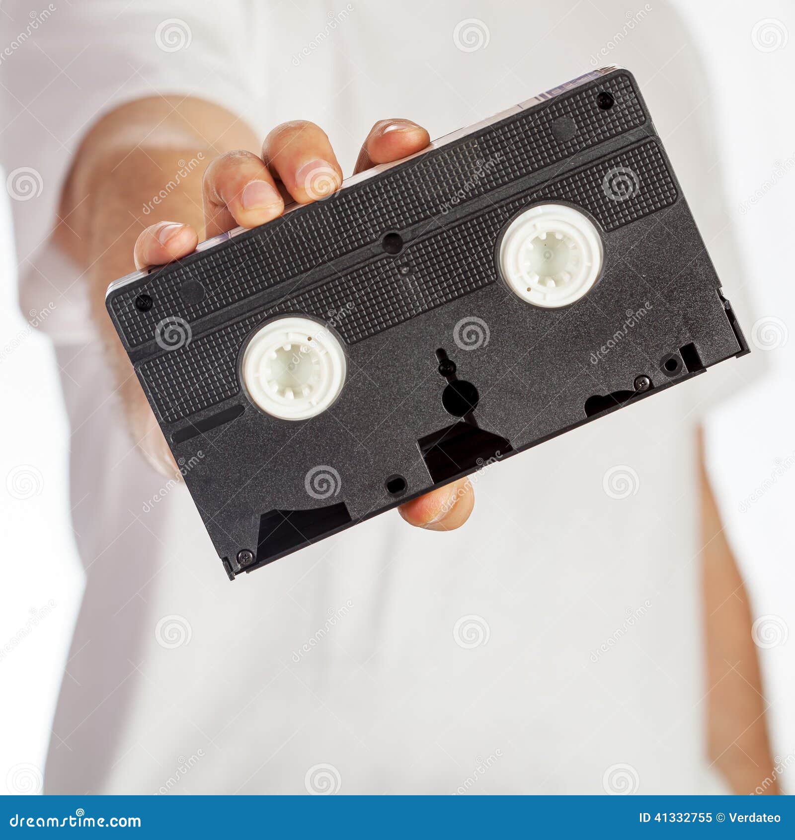 VHS cassette hold by hand stock image. Image of tape 41332755