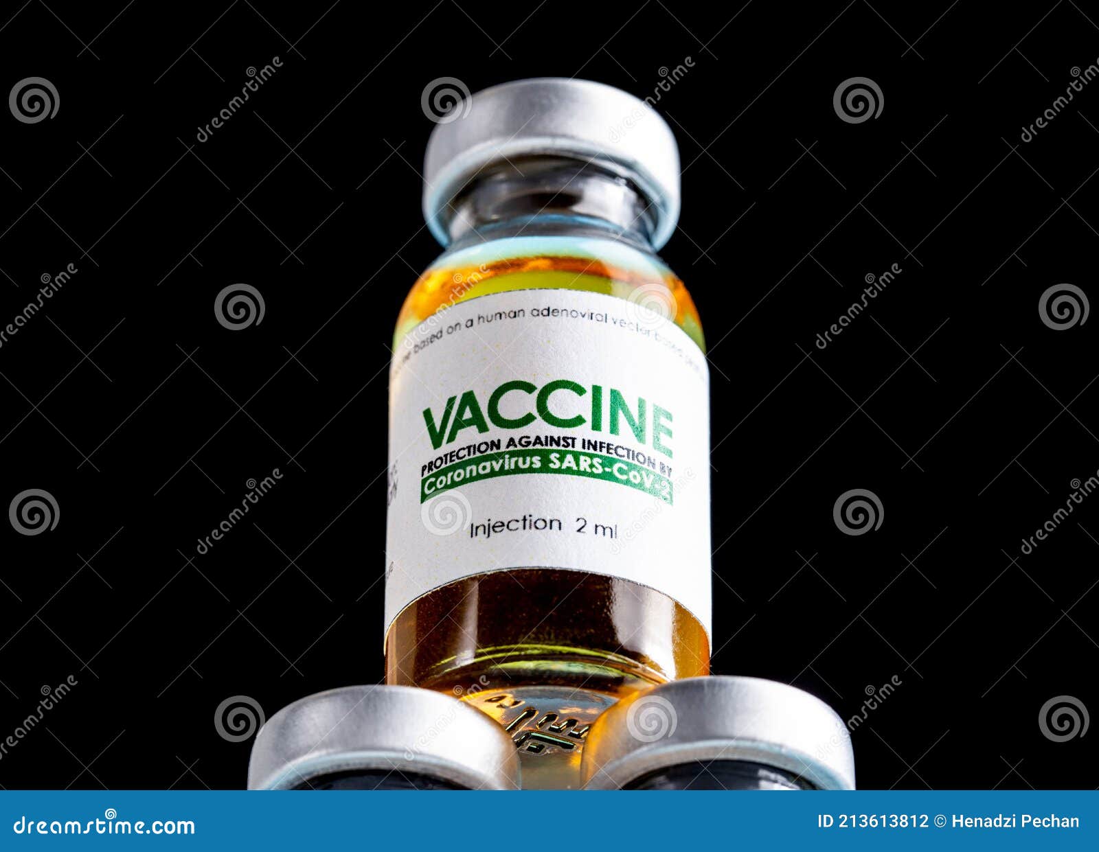 vial with coronavirus vaccine on a black background, close-up. vaccine development and research concept sars-cov-2 and covid-19