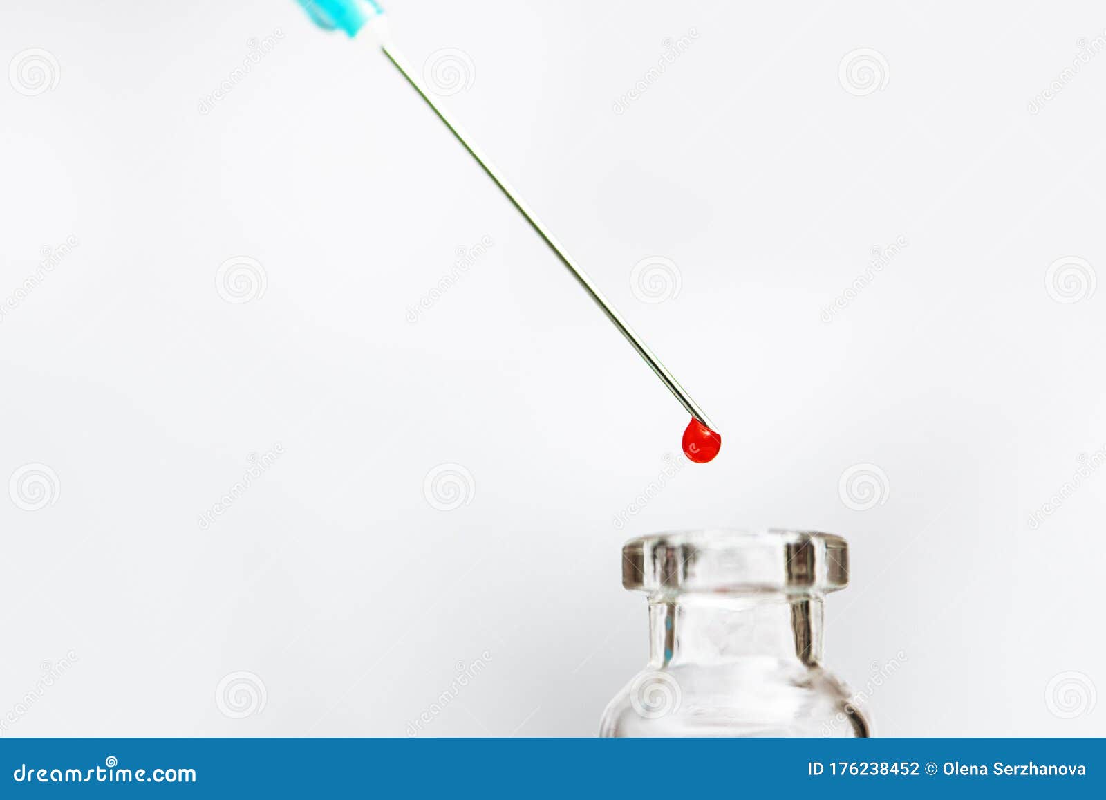 Vial and Syringe Needle with Drop of Fluid. Stock Photo Image of