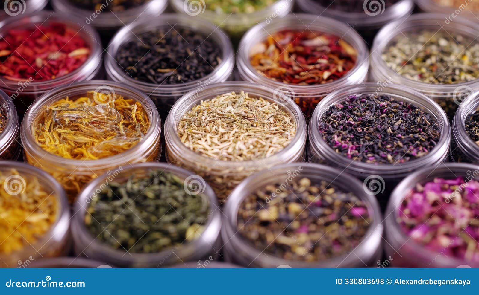 vibrant assortment of loose leaf teas in glass jars