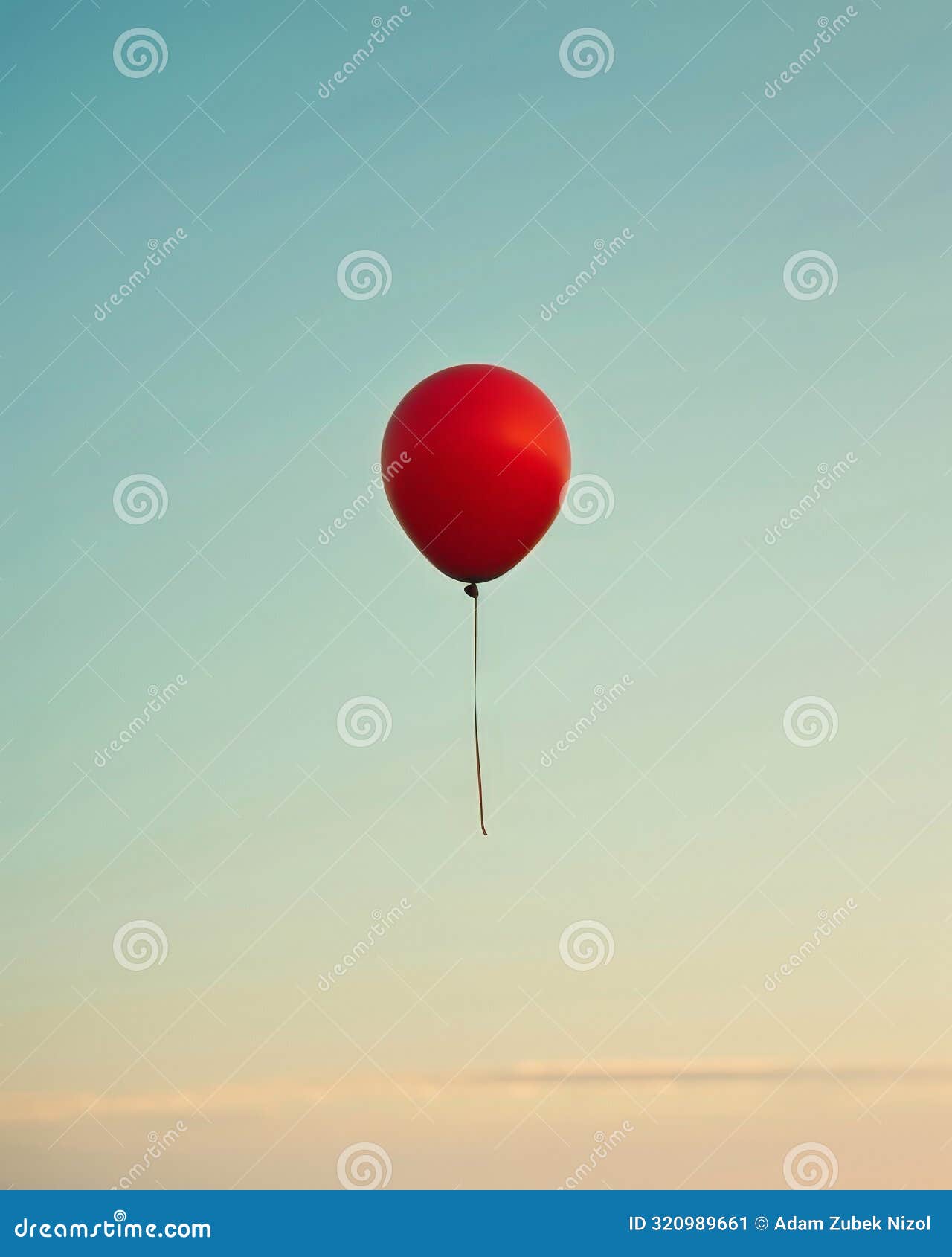 vibrant red balloon floating in the sky