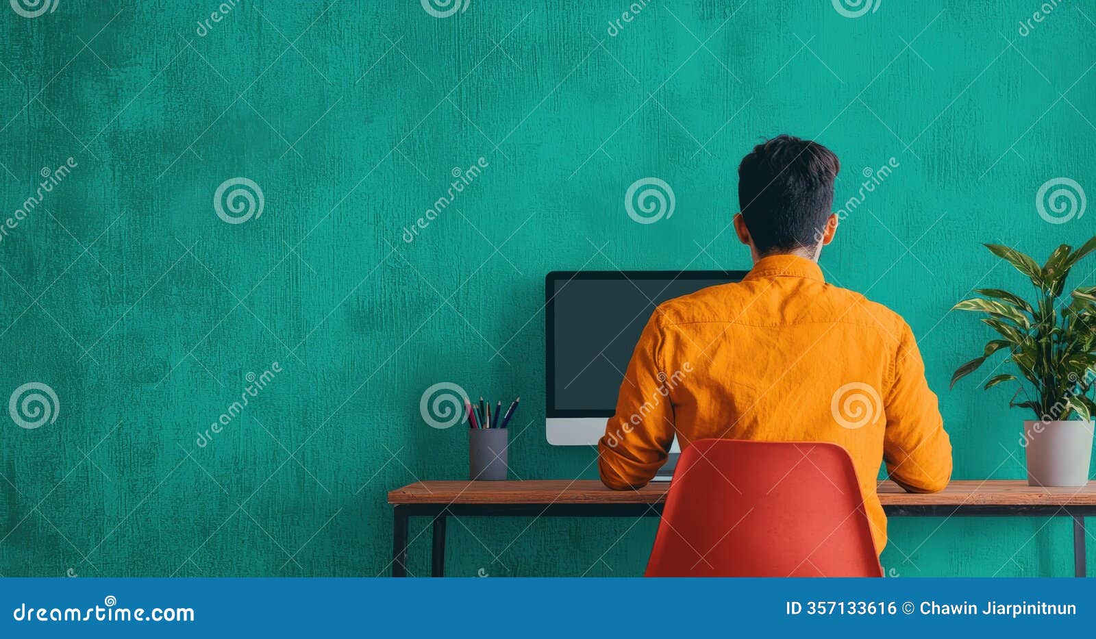 vibrant workspace with person working at computer in modern setting generated by ai