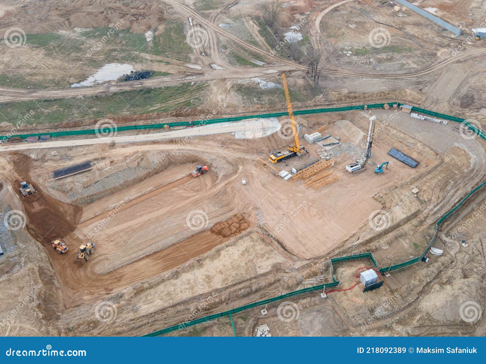 vibration road roller and wheel loader leveling ground for construct of foundation. soil compactor compresses soil under the