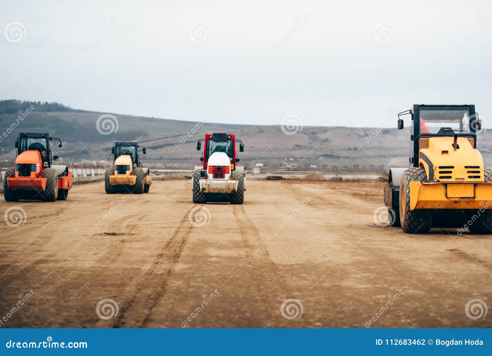 vibratory compactor during road and highway construction. industrial roadworks with heavy-duty machinery