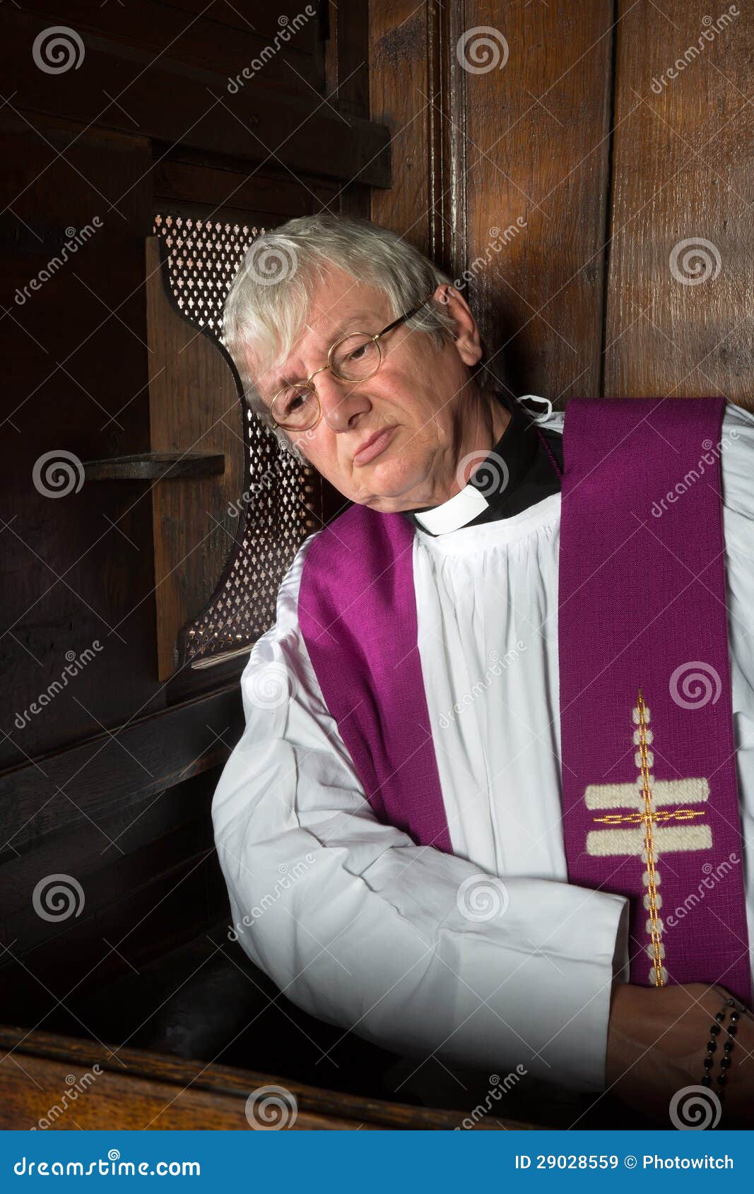 vicar in confession booth