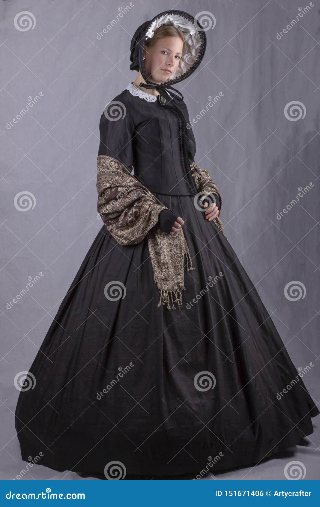 victorian woman in a black bodice, shawl and bonnet
