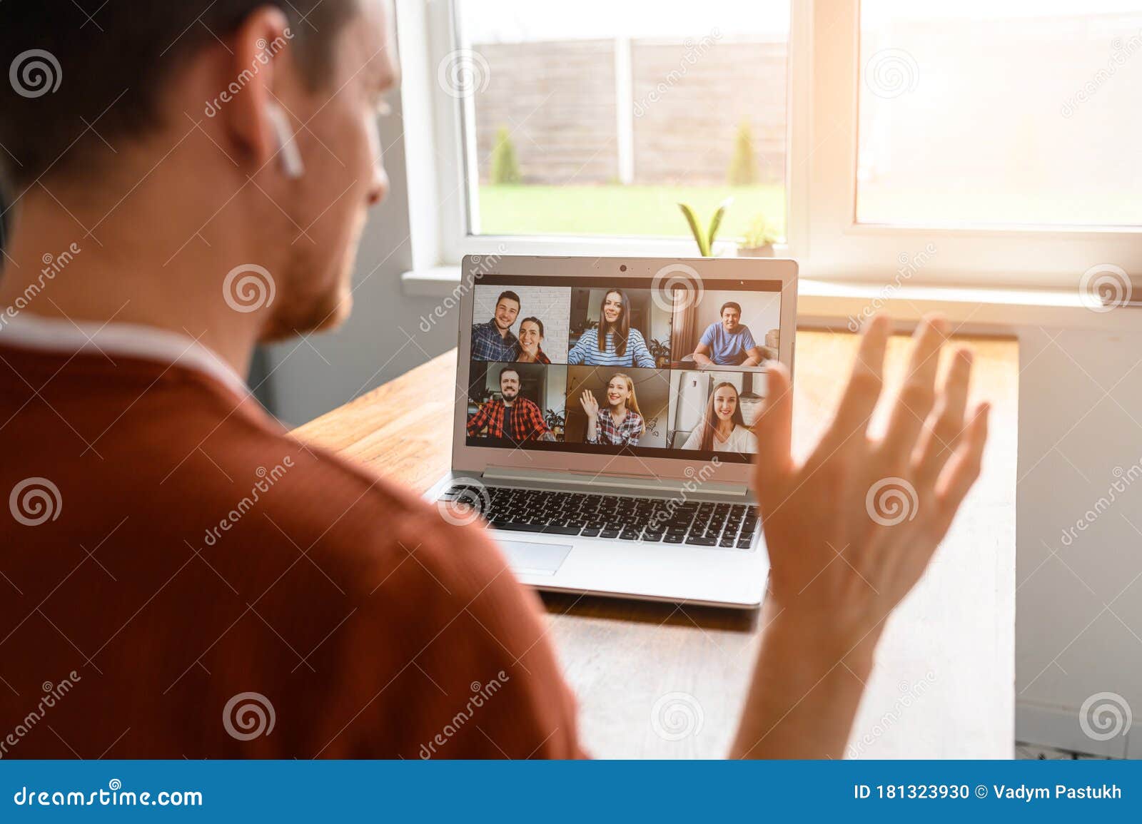 a guy is using laptop for video call, zoom