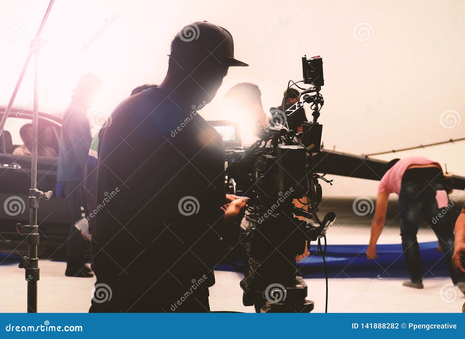 Video Camera in Film or Movie Production on Tripod Stock Photo