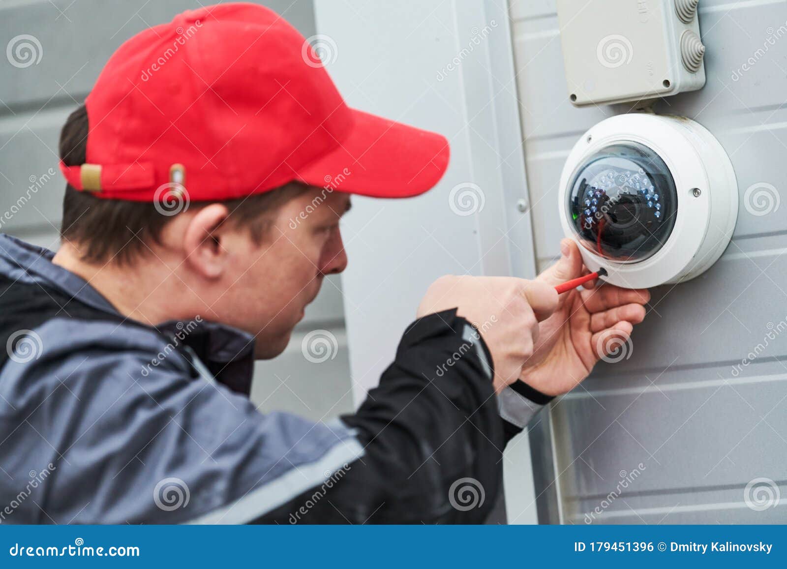 video surveillance service. technician installing camera