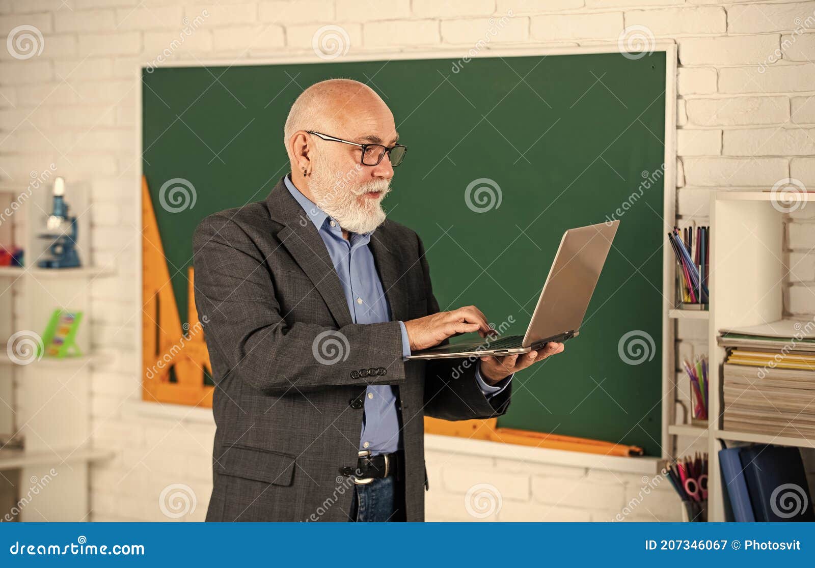 videoconferencing keeps homebound students connected. senior intelligent man teacher use laptop. distant education goals