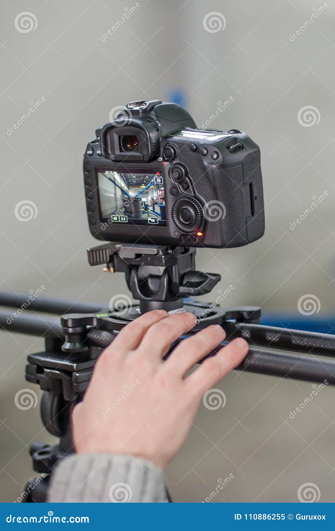 Videographer Using Camera Slider, Making Video of Business at Fa Stock